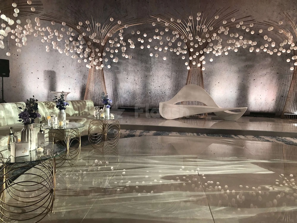 Lobby at DoubleTree by Hilton Resort & Spa Marjan Island, Ras Al Khaimah, with illuminated spherical chandeliers and sculptural